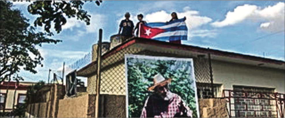 PRIDE — Cubans put up photos of Castro and wrote his name on their faces in honor of him. Photo Credit: Photo Provided
