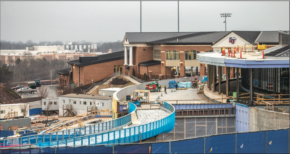 BUILD — A work crew began construction on the walkway. It will be completed spring 2018. Photo Credit: Amber Tiller