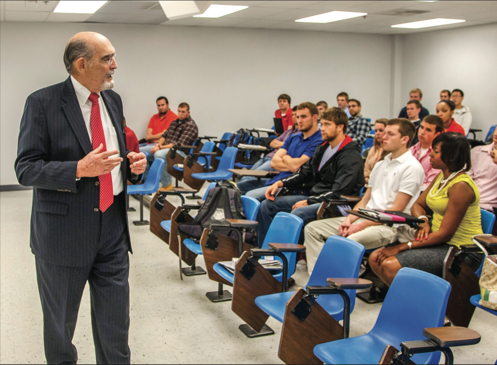 Teach — Former Provost Dr. Ron Godwin lectured a business class at DeMoss Hall in 2012. photo Credit: Les Schofer