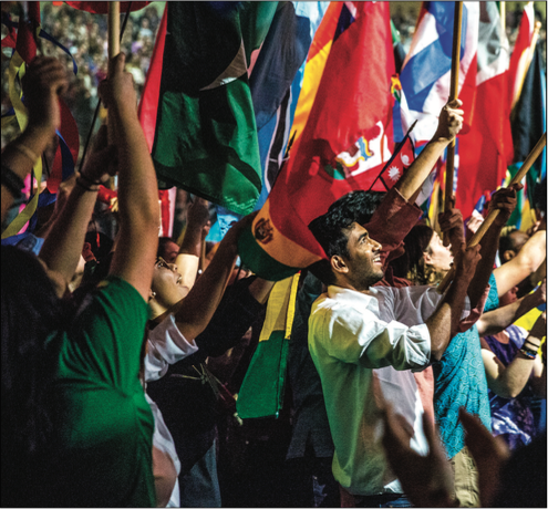 CULTURES — The Parade of Nations included 156 students representing 87 countries. Photo Credit: Michela Diddle