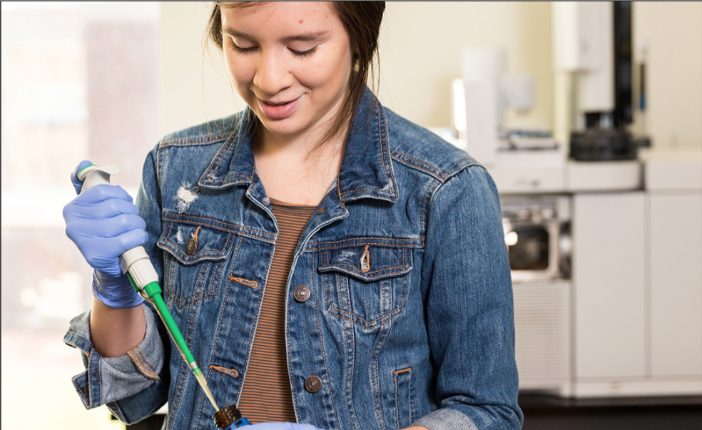 EXPERIMENTING — Junior cell and molecular biology student Stefany Orellana researched and studied the effects of essential oils on bacteria in the human body. Photo Credit: Kaitlyn BecKer Johnson