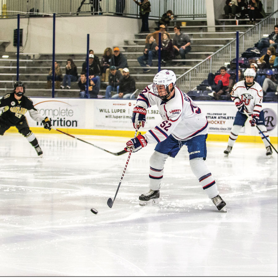 OPEN — Sophomore defenseman Zane Schartz shot the puck earlier this season against Oakland. Photo Credit: Caroline Sellers