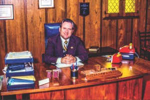 Dr. Jerry Falwell sits in his office. Date and photographer unknown.