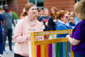 students picking necklace colors at event