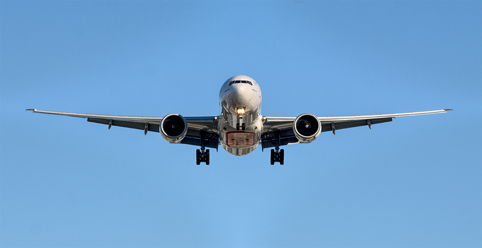 Photo of flying airplane. Photo from Unsplash by Emanuview.