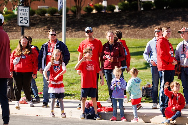 Alumni and their families lined the parade route for the Homecoming Parade. Photo by Travis Clayton Liberty Marketing.