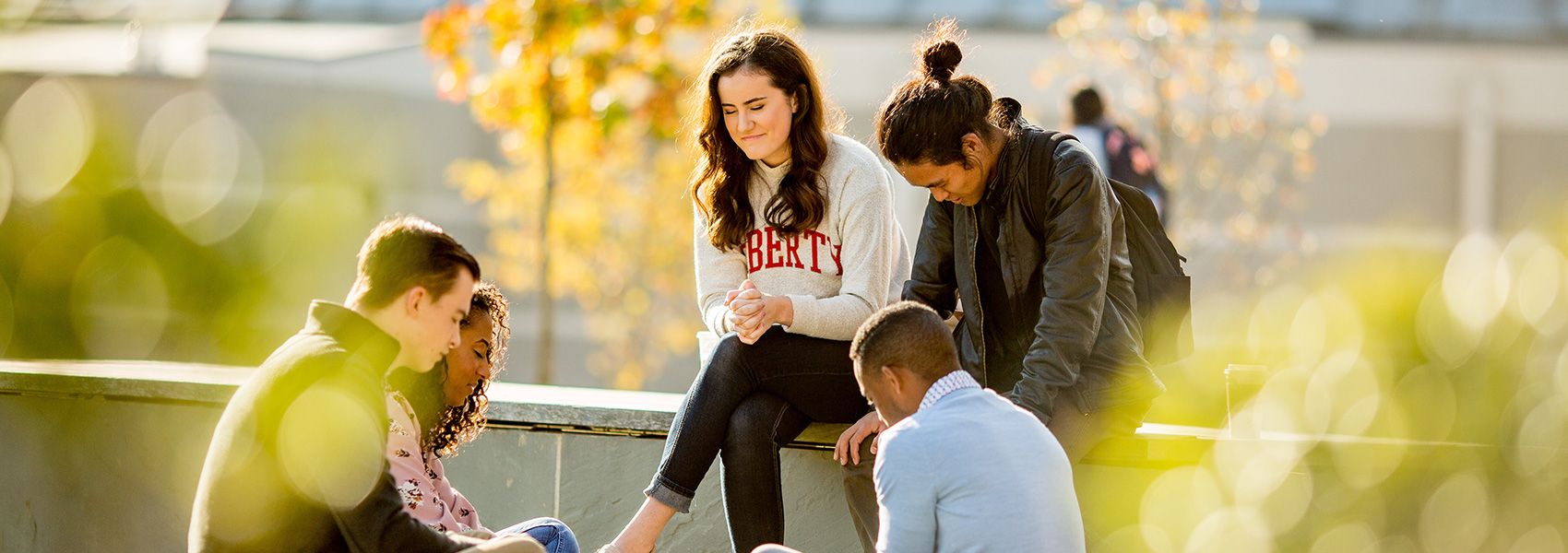 students praying on campus