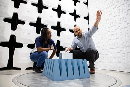 Associate Dean Carl Pettiford works with student in an electromagnetic chamber at Liberty's School of Engineering.