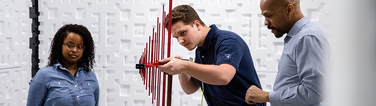 Liberty University faculty and students working in electromagnetic chamber