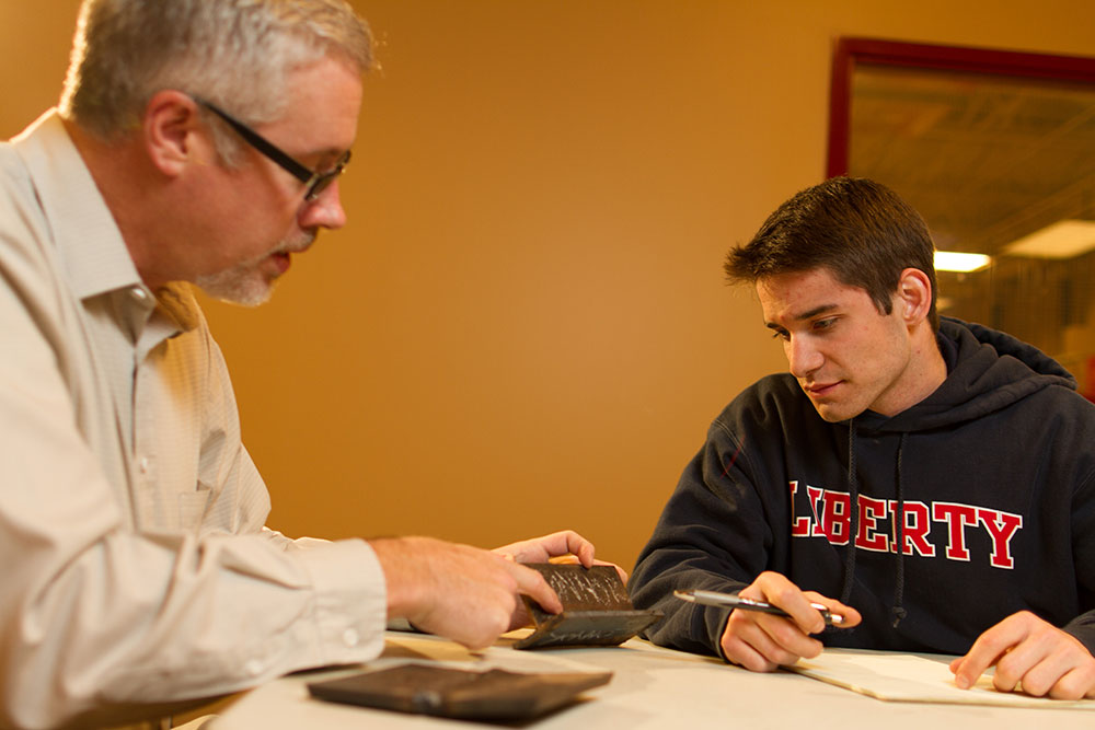 Assistant professor Lane McClure (left) with junior Colby Bishop