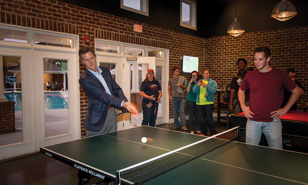 President Jerry Falwell, Jr. plays pingpong with students in the newly renovated David's Place.