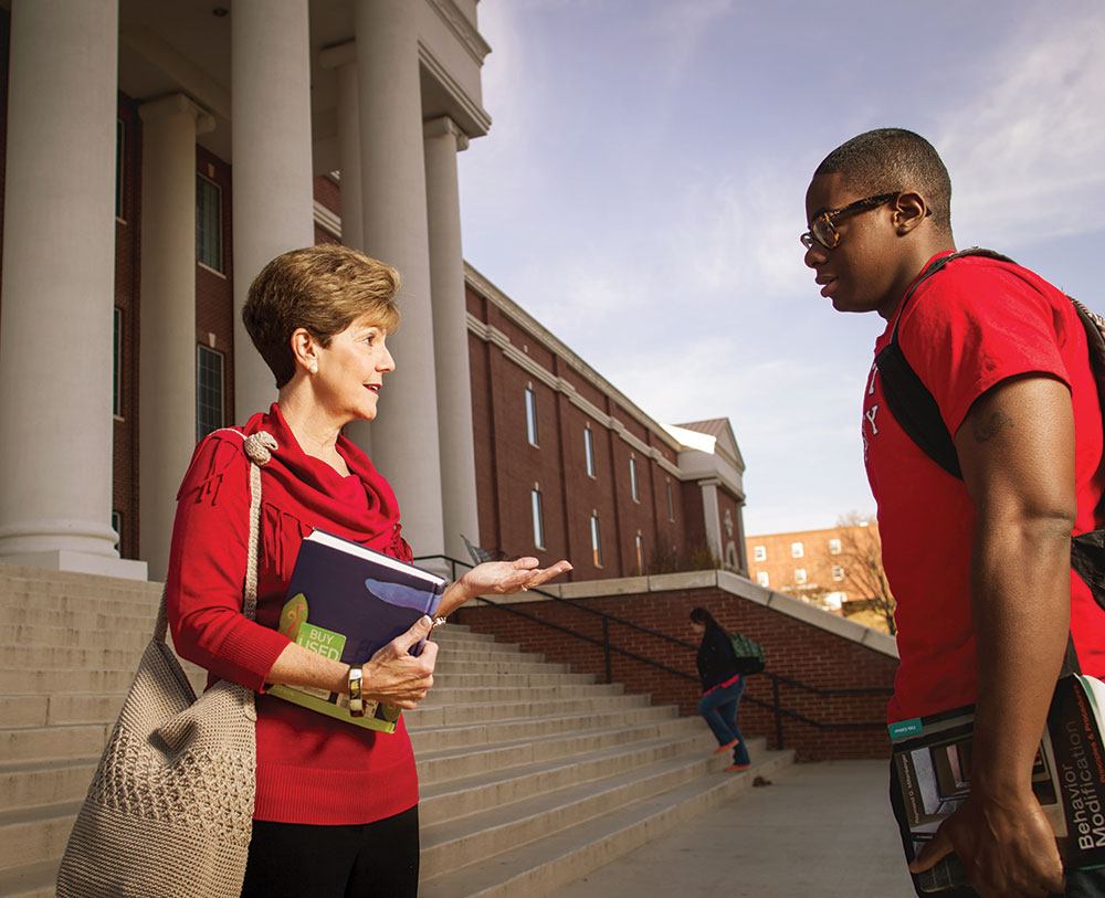 Denise Green meets with one of her former students, Shaquille Cook.