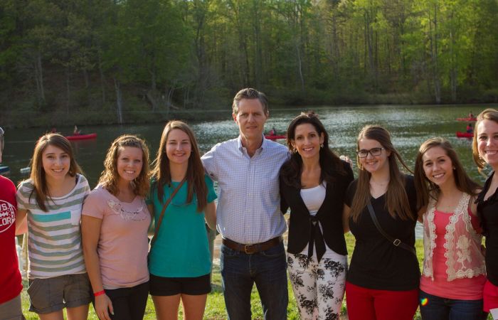 President Jerry Falwell and his wife, Beki, pose with members of the Class of 2014 at the seventh annual Senior Picnic on May 3 at Liberty's Camp Hydaway.