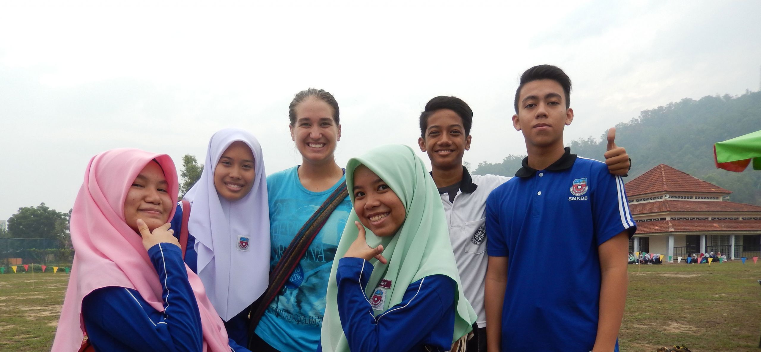 Cheryl Watson poses with some of the students she taught in Malaysia.