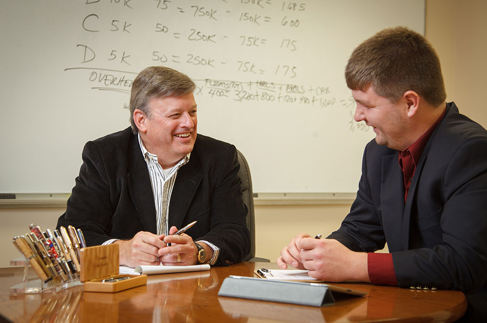 Dr. Kendrick Brunson (left) with senior Anders Bengston