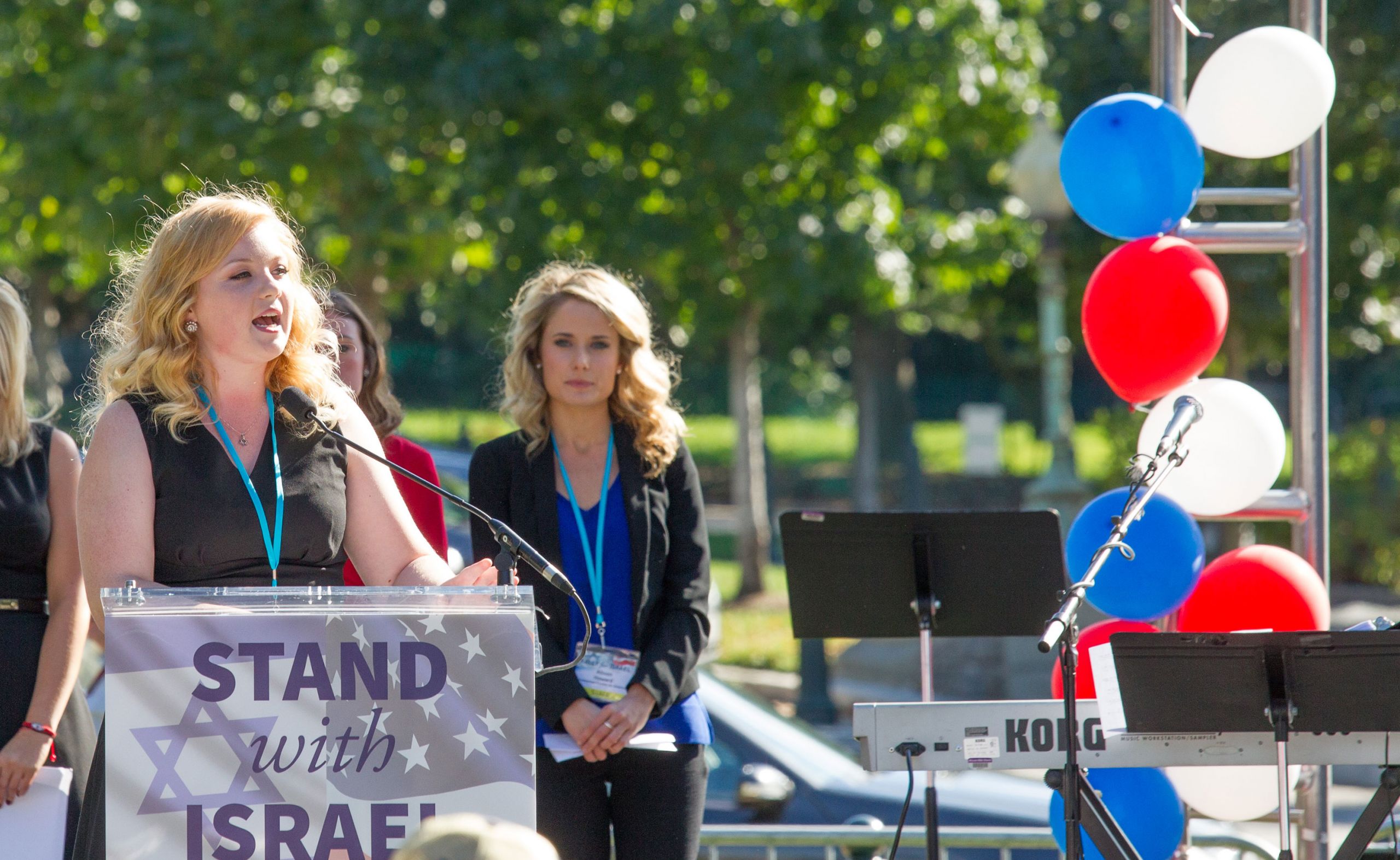 Chelsea Andrews speaks at a Stand with Israel rally.