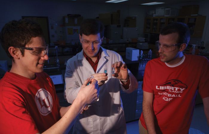 Liberty University chemistry students and professor.