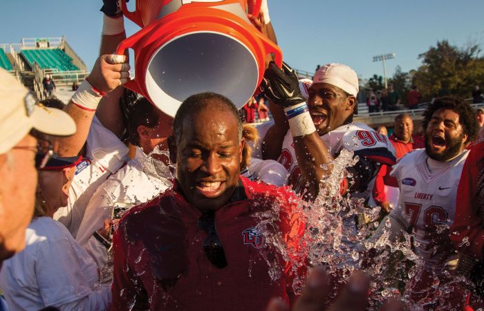 Flames head coach Turner Gill gets doused after a big win.