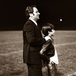 Jerry Falwell, Sr. and Jerry Falwell, Jr. watch a Liberty football game in 1974.