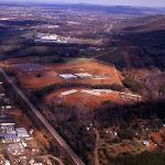 his photograph taken over Wards Road in December 1977 shows the first two academic buildings and the first four residence halls built on campus. Four additional buildings were under construction for on-campus housing.