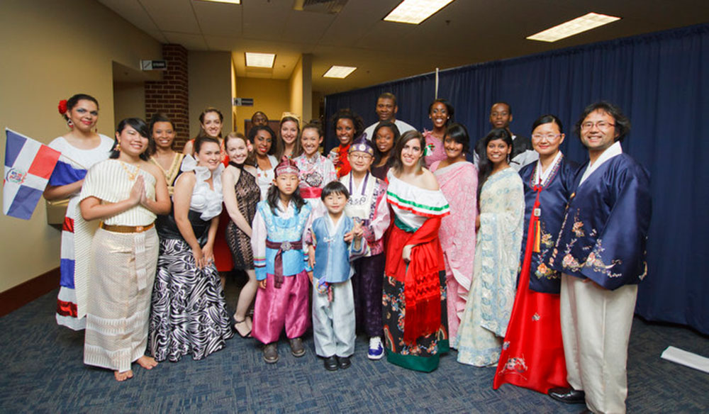 Students model traditional clothing for the fashion show at the Mosaic Mixer, kicking off International Week at Liberty University.