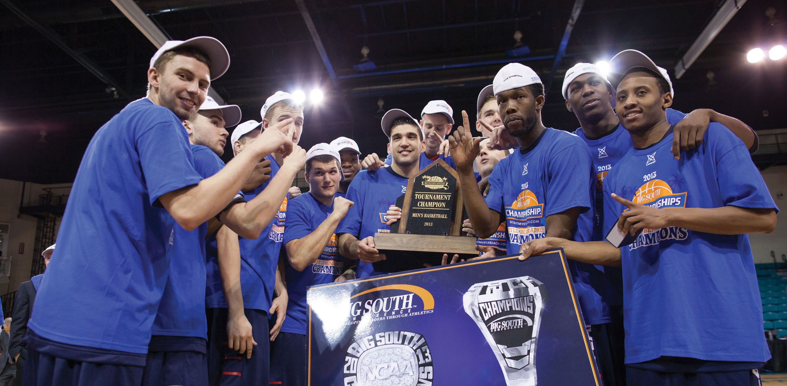 Liberty men's basketball celebrates winning the Big South Championship.
