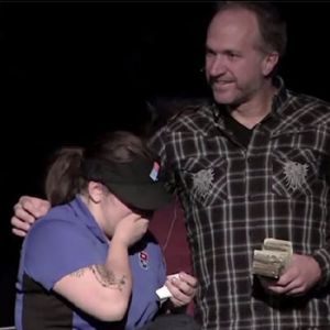 The Rev. Steve Markle gives a Dominos worker a large tip on behalf of his church.