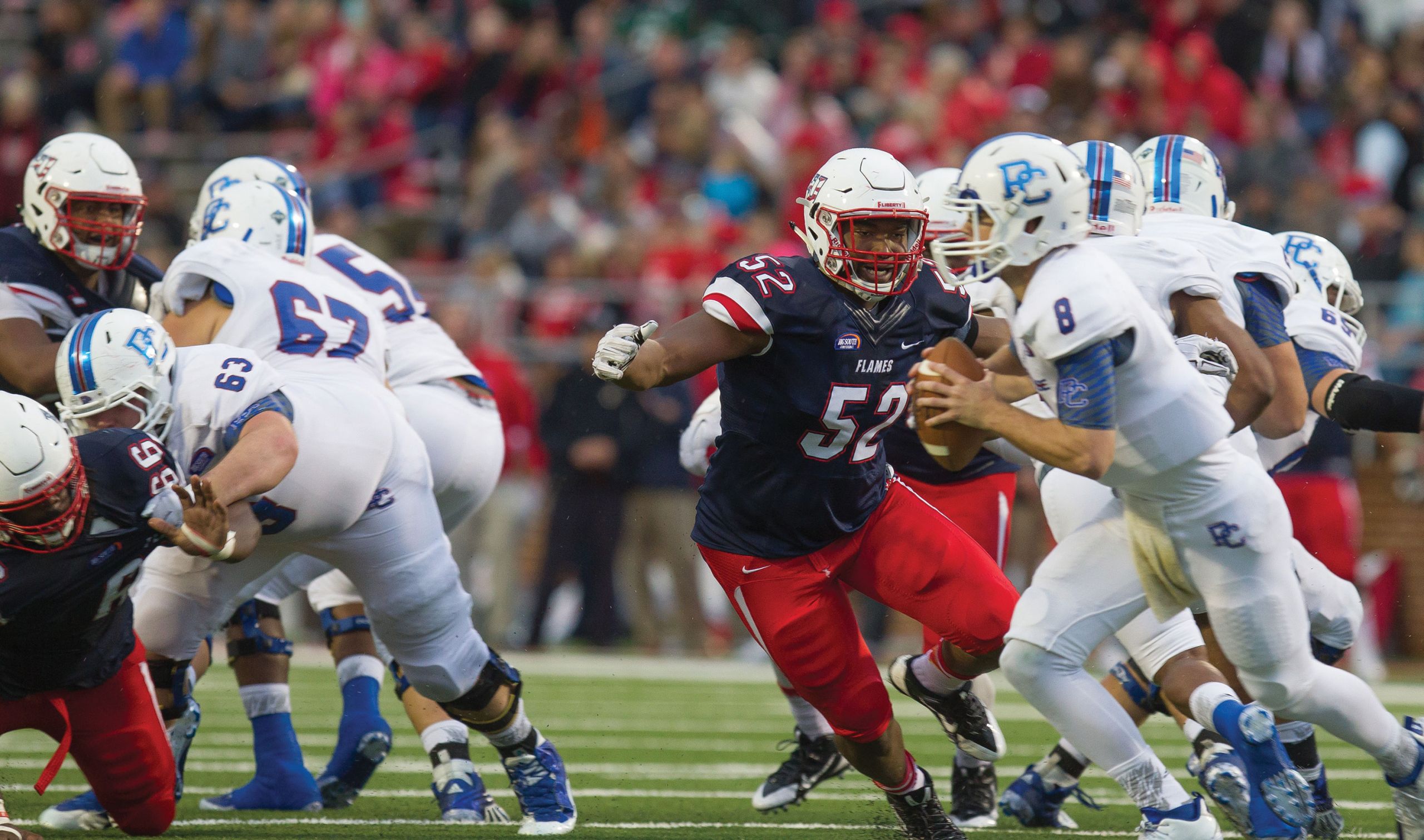 Chima Uzowihe and the Liberty Flames Football Team host Presbyterian.