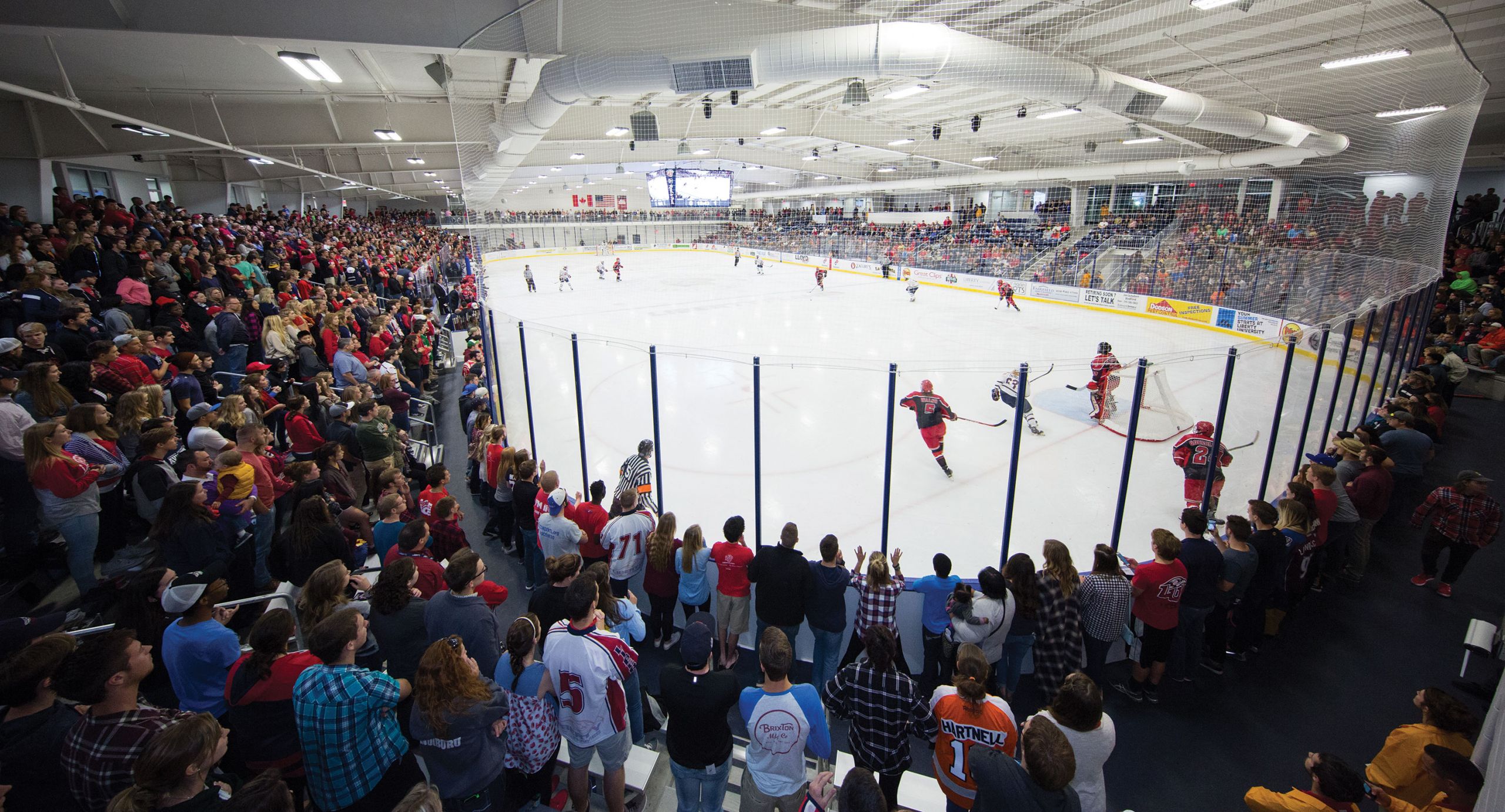 Liberty University's ACHA DI men's hockey team takes the ice in front of a record crowd during the grand re-opening of the expanded and renovated LaHaye Ice Center.