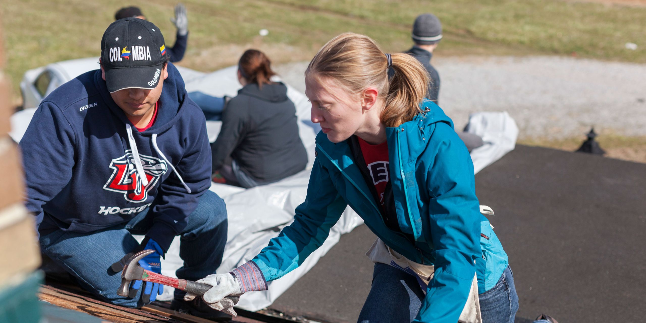 Liberty University students Micah Green and Hannah Lankford asset with cleanup and rebuilding.