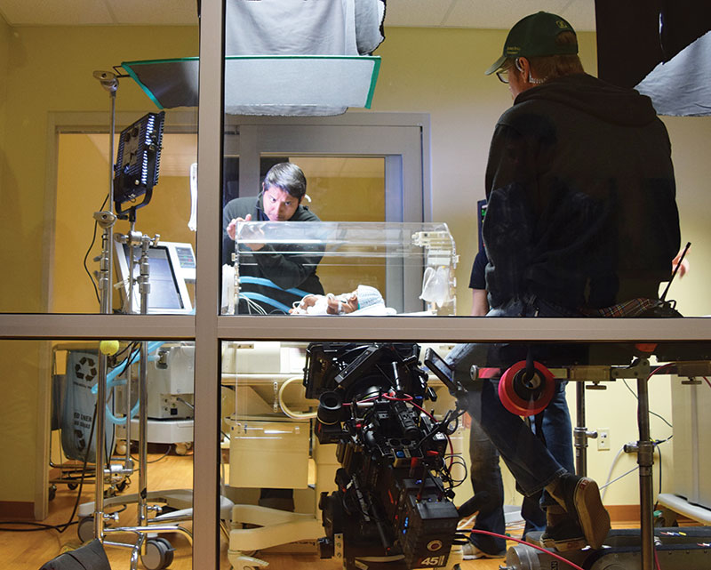 Recent cinematic arts graduate Marvin Diaz helps stage a scene for “God’s Compass” at a health care facility in Lynchburg, Va.