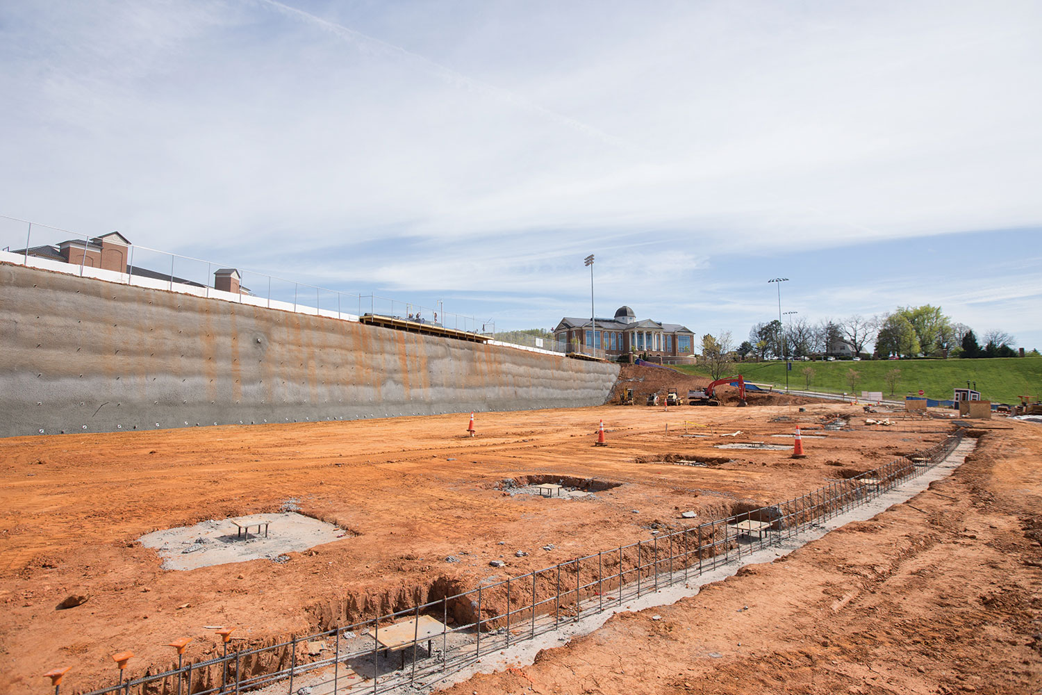 Liberty's forthcoming Academic and Performance Center is being built into the existing hillside between the Liberty Baseball Stadium and Osborne Stadium.