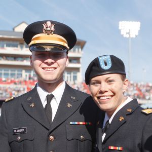 Two military graduates celebrate Commencement.