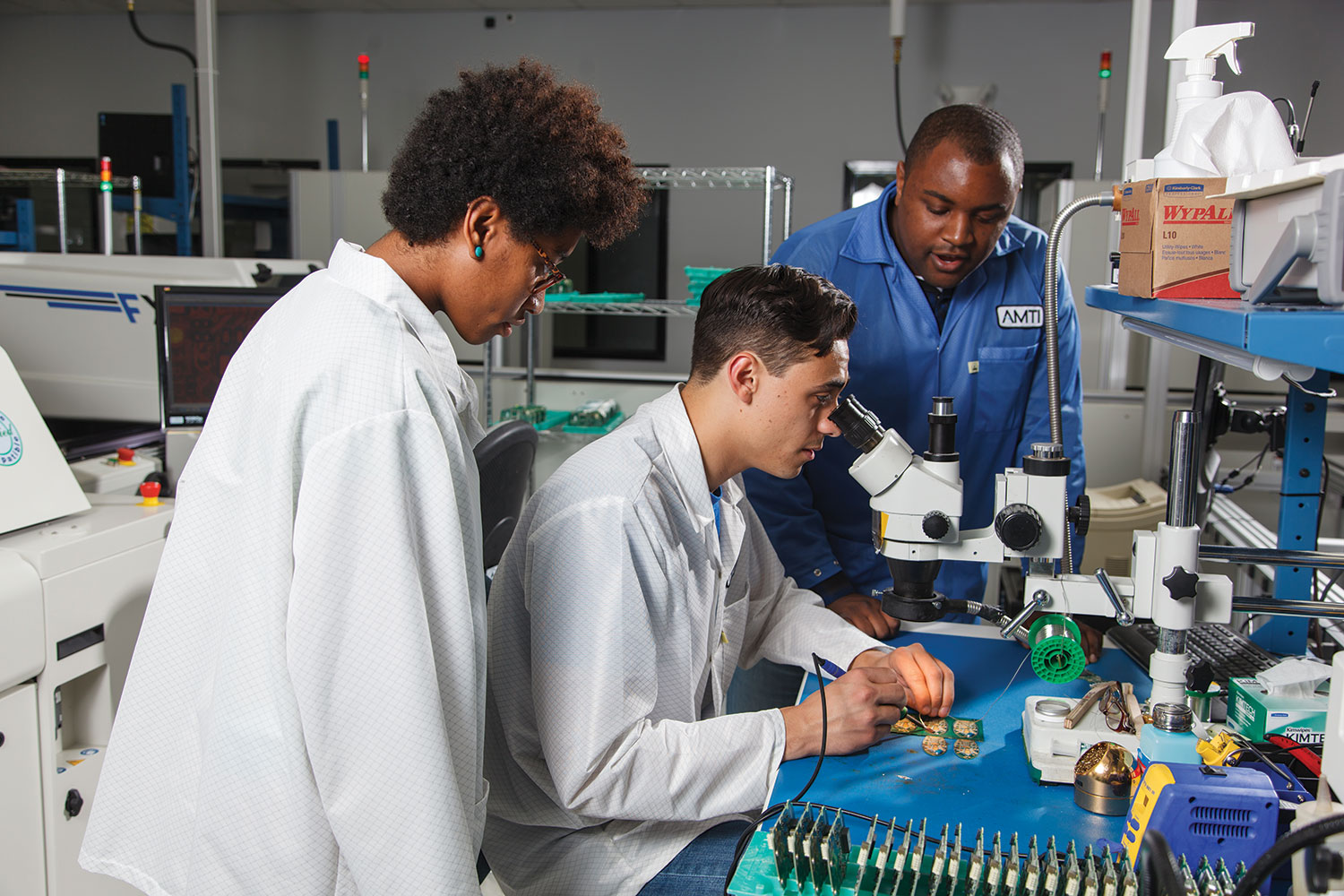 The software and electronics team works in a lab at AMTI.