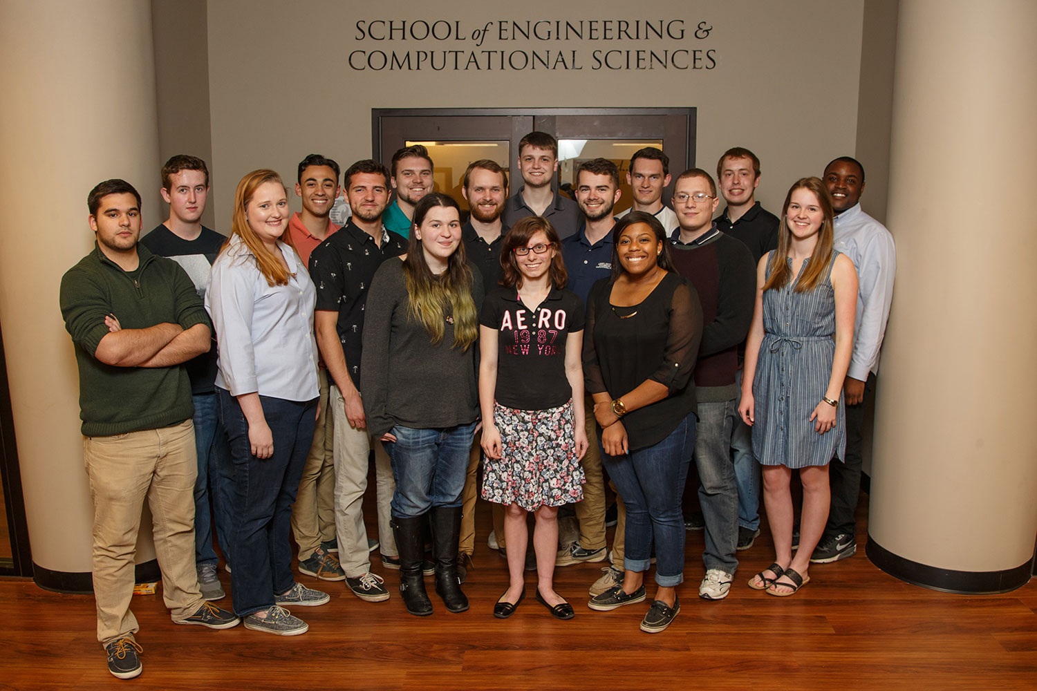 Several members of the BioMechatronic EXO-Arm project, —representing a number of organizations, including many from Liberty University — gather in Liberty University's School of Engineering & Computational Sciences.
