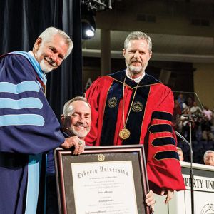 Provost Dr. Ronald Hawkins (left) and President Jerry Falwell (right) conferred upon Tim Lee an honorary Doctor of Divinity.