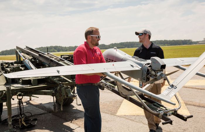 Liberty University assistant professor Steven Brinley and UAS student Luke Reddaway prepare to launch a Textron Systems Aerosonde Small Unmanned Aircraft at Textron's facility in Blackstone, Va.