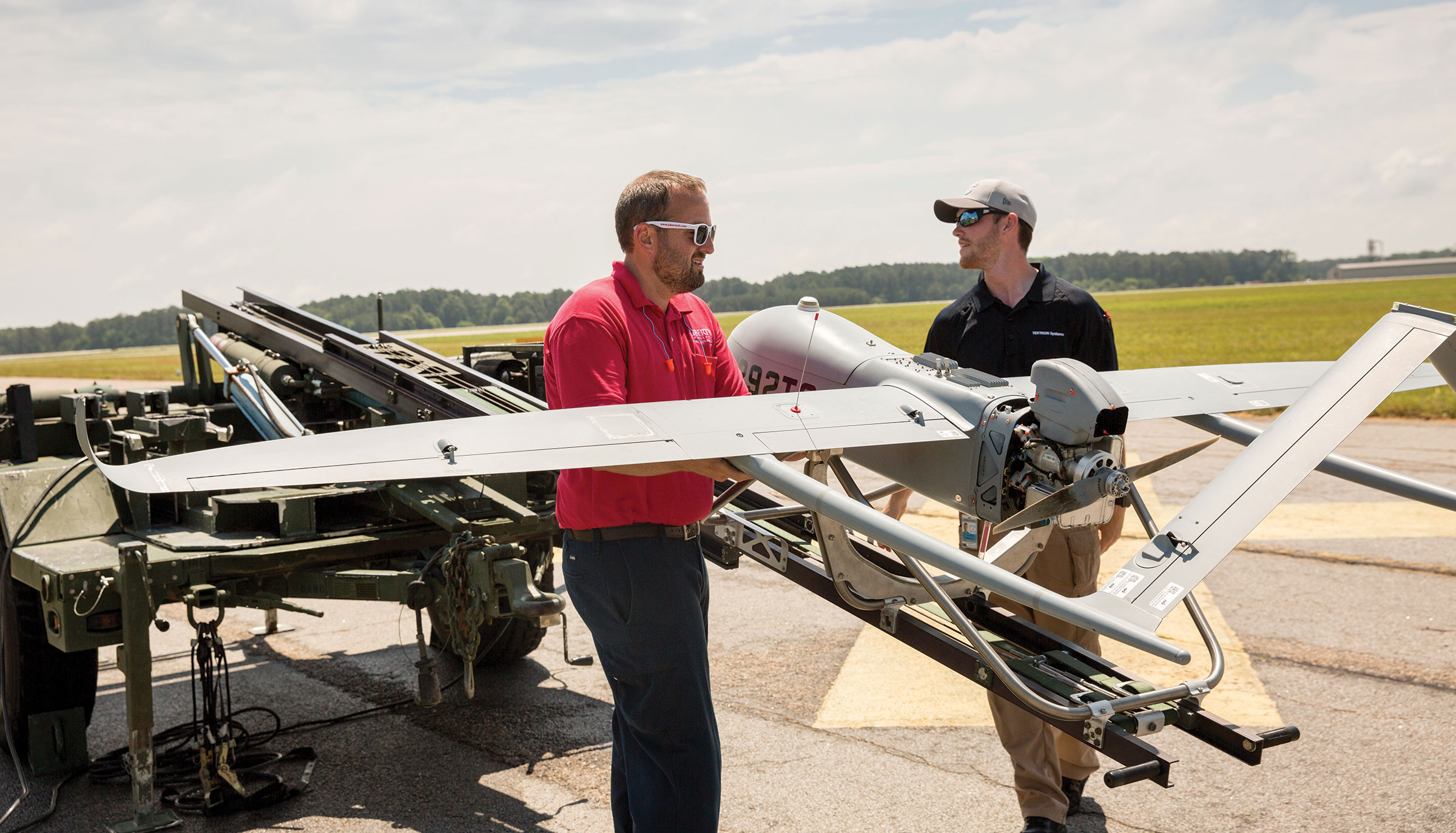 Liberty University assistant professor Steven Brinley and UAS student Luke Reddaway prepare to launch a Textron Systems Aerosonde Small Unmanned Aircraft at Textron's facility in Blackstone, Va.
