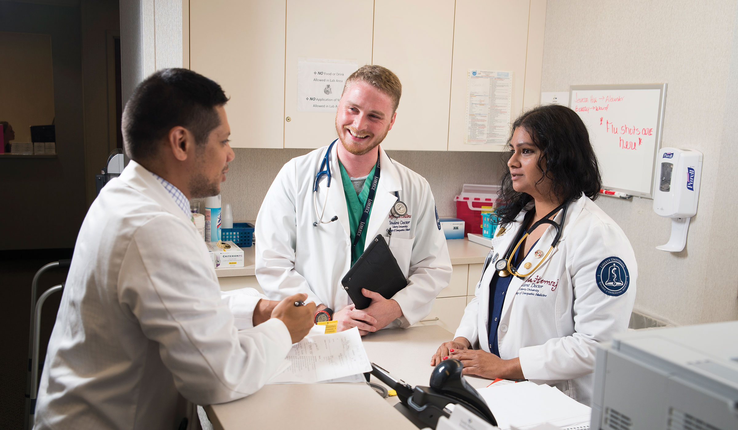Third-year student-doctors (from left to right) Ernesto Enrique, Jeffrey Collins, and Nia Hemraj are working at the Danville Regional Medical Center, completing their clinical rotations.