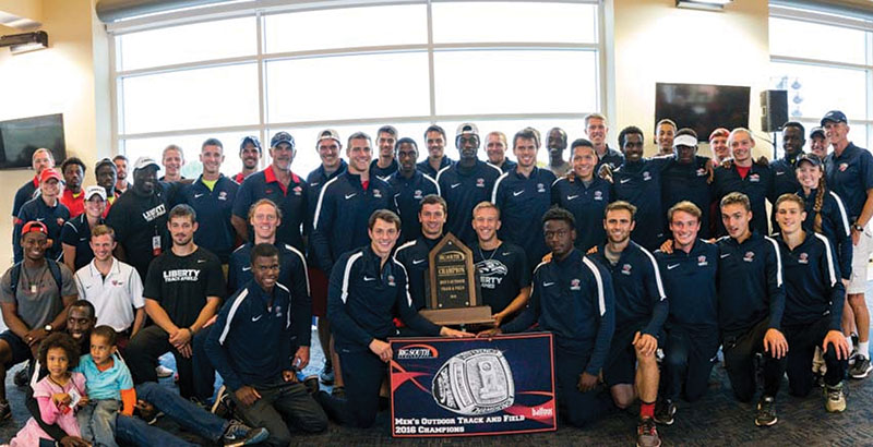 Liberty’s men’s outdoor track & field team celebrates its 21st Big South Championship title in May. (Photo by Kevin Manguiob)