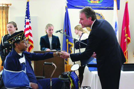 Congressman Robert Hurt presents commemorative pins to Vietnam veterans during his time in the U.S. House of  Representatives.