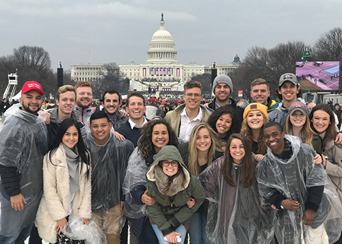 Students pose in front of the Capitol Building when they arrived for the Inauguration. Five buses of students left campus early Friday morning.