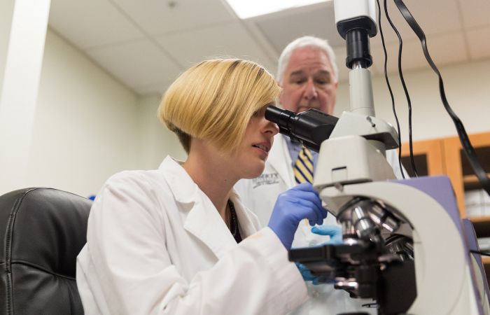 A Liberty University student conducts research in the Center for Natural Sciences.
