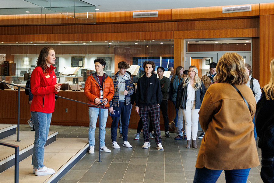 Student tour guide Taylor Lowe talks with families inside the Freedom Tower, home to the John W. Rawlings School of Divinity.