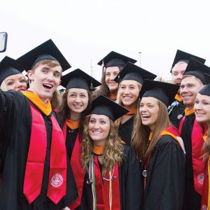 Graduates take a selfie during Liberty University's 42nd Commencement.