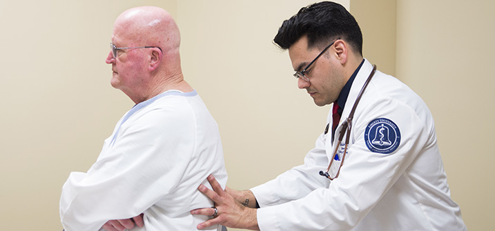 LUCOM student-doctor and patient.