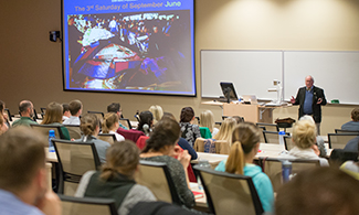 Dr. D. Holmes Morton during lecture at CMHS