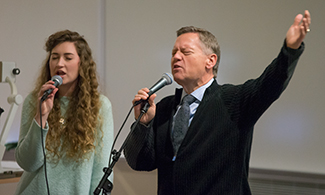 Scott Bullman helps lead worship during LUCOM convocation.