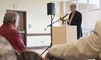 Dr. Godwin offers remarks.