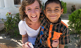 Student-doctor Megan Hoffer poses with a Guatemalan child.
